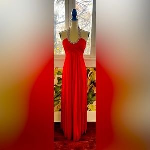 Evening gown with rhinestone tie behind the neck. No zipper, only elastic band